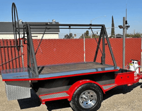 Red flatbed utility trailer with metal frame