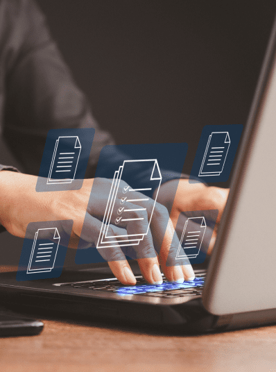 Hands typing on laptop with floating document icons